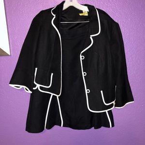 Black suit, with white piping by Jillian Jones.